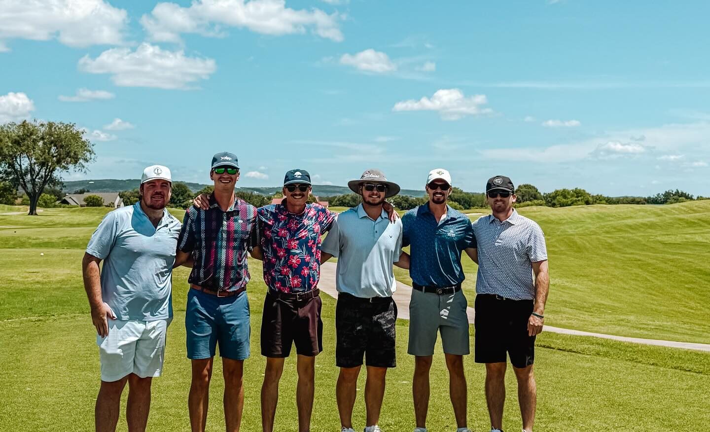 guys on golf tee box at golf trip